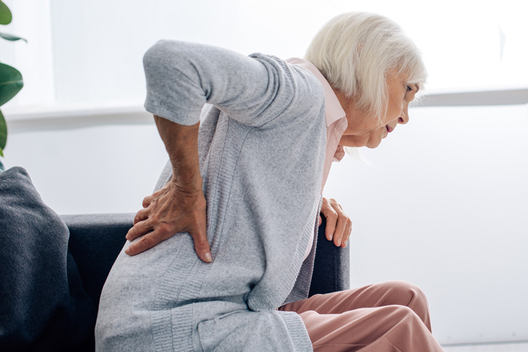 ExcellentCarePharmacy_Arnprior_Ontario_Drive_Thru_back_pain_senior_woman